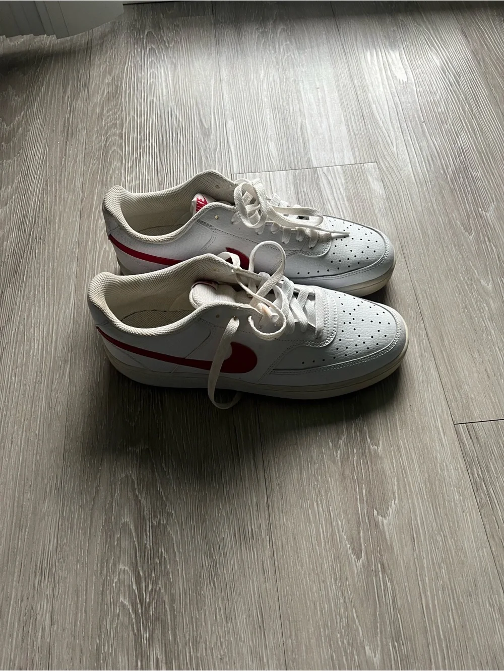 Nike Kids White Sneakers with Red Swoosh